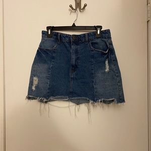 Distressed light wash denim mini skirt